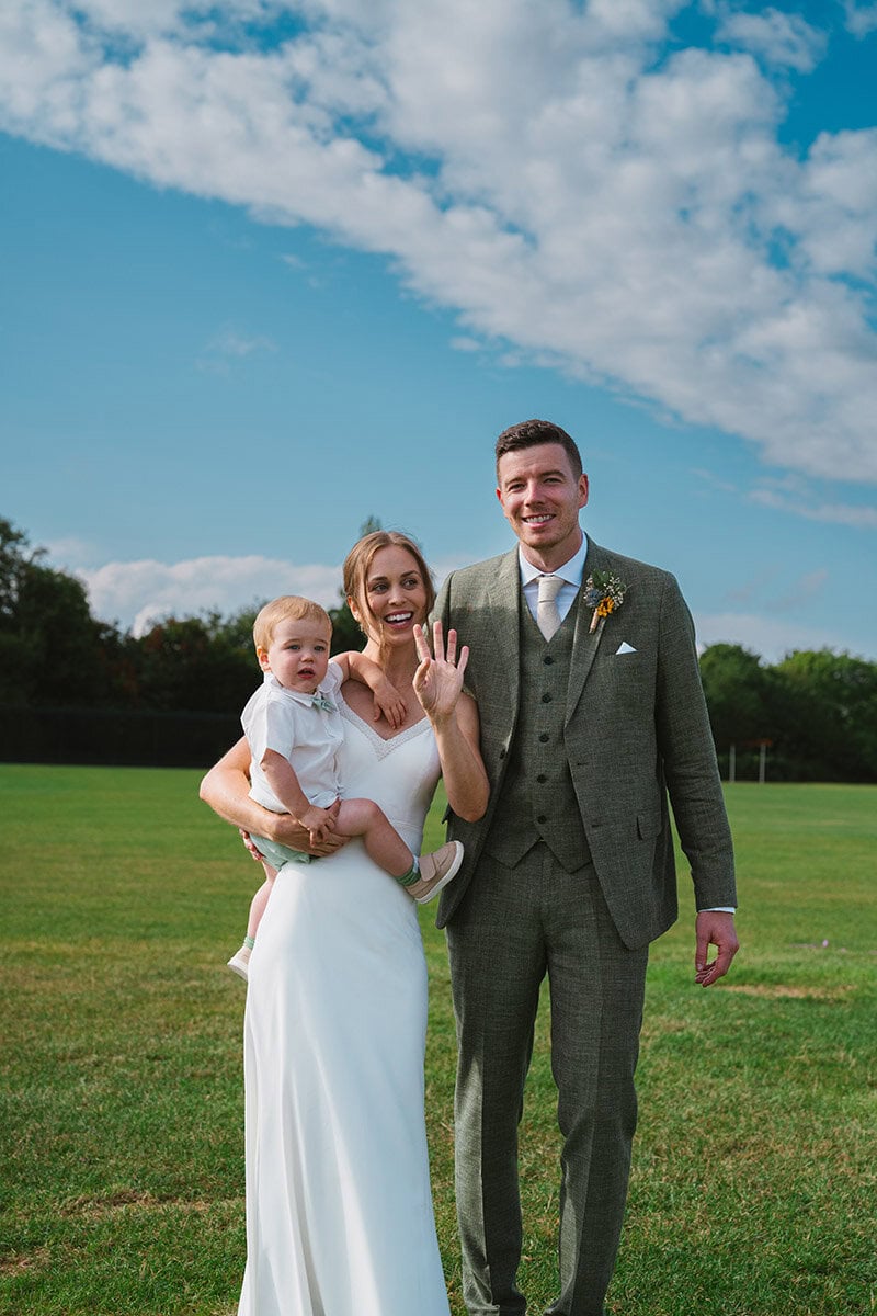 Happy wedding family outdoor celebration smiling couple.