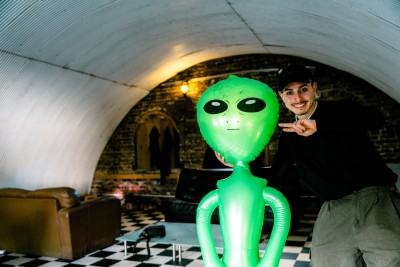 Extraterrestrial-themed balloon art in a modern interior setting.