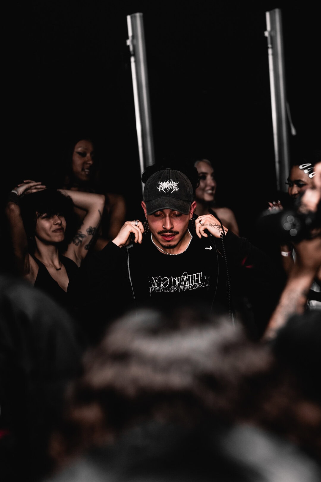 DJ surrounded by dancers, London nightlife photographer