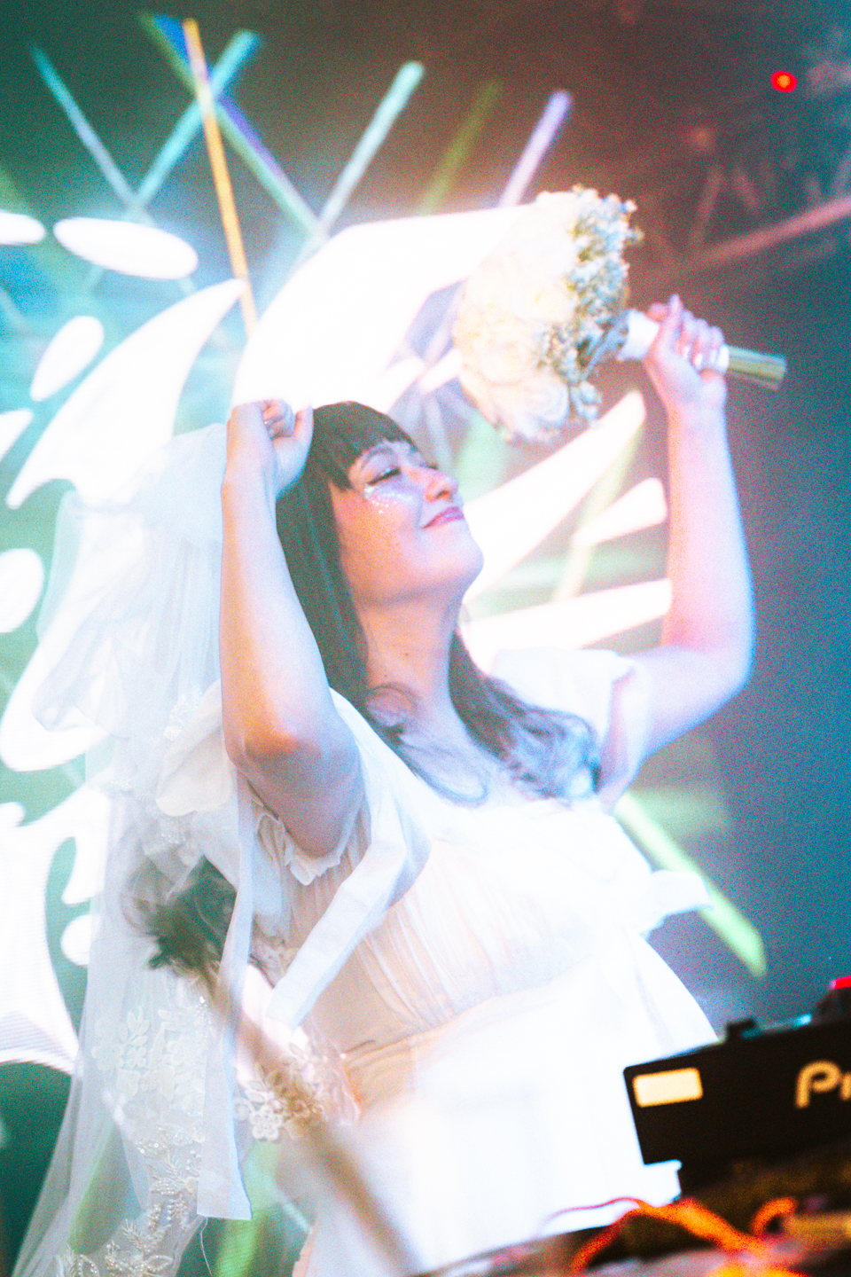 Performer on stage with a microphone