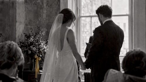 Couple exchanging vows in monochrome