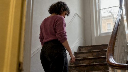 Woman relaxing her stance during portrait practice