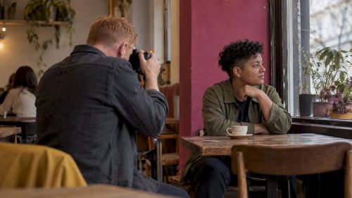 Client photographed in a familiar London café