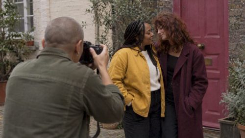 Photographer making portraits of a queer couple